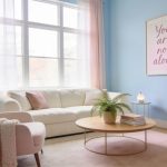 Peaceful therapy office in Guelph for postpartum depression counseling, featuring soft pastel decor, comfortable seating, and a framed wall sign reading "You are not alone