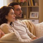 Couple discussing relationship concerns in a cozy setting, highlighting intimacy and trust.